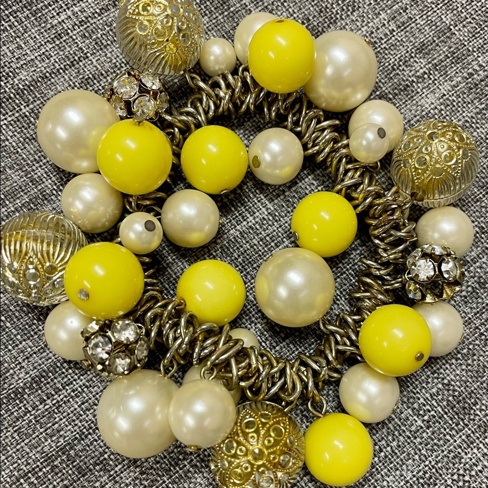 Yellow, white, and gold tone bracelet